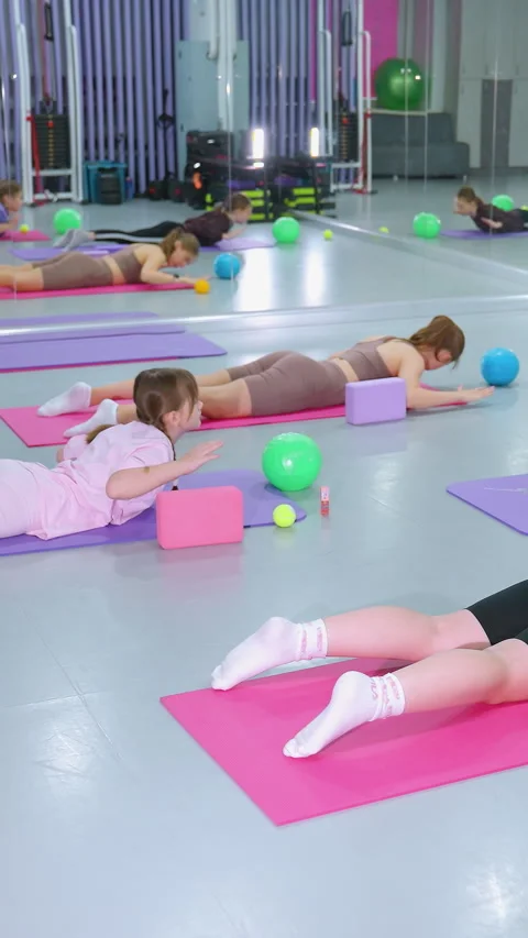 Aerial View of Fat Burning Exercise Session With Instructor in Gym Stock Footage 318733461
