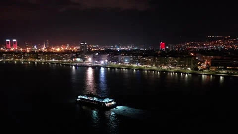 Aerial view of the ferry advancing on the Aegean Sea with a night view of the Stockbeeldmateriaal 236814774