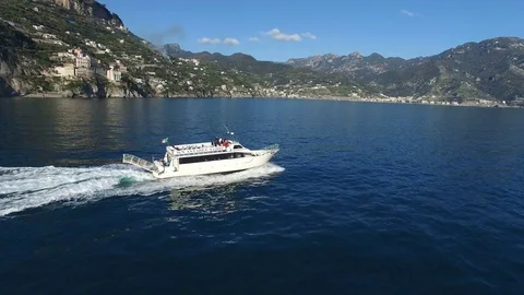 Aerial view of a ferry navigating off the coast of Amalfi Stock Footage 72108892