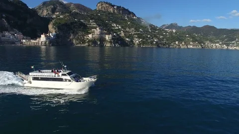Aerial view of a ferry navigating fast off the coast of Amalfi Stock Footage 72109045