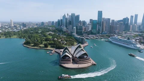 Aerial view of a ferry passing the Sydney Opera House, sunny day in Australia 動画素材 325692479
