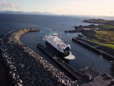 Aerial View of Ferry pulling into Marina in Denmark. Slow Rise with Tilt Down. Stock Footage 82980924