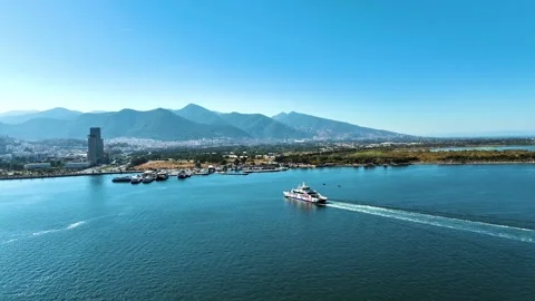 Aerial view of the ferryboat in Izmir approaching the passenger pier accompanied Stock Footage 242578261