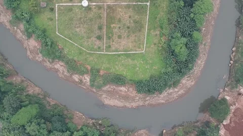 An aerial view of field next to a river Stock Footage 150417901