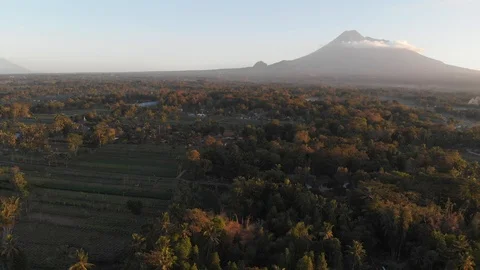 Aerial view of fields and beautiful mountain while sunrise Stock Footage 107702313