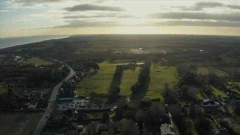 Aerial view of Fields and cliffs next to the sea in Hornsea, East Yorkshire, UK Stock Footage 121442526