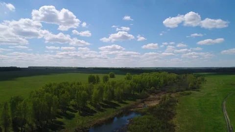 Aerial view of fields and forest clouds river village Siberian landscape Stock Footage 75810947