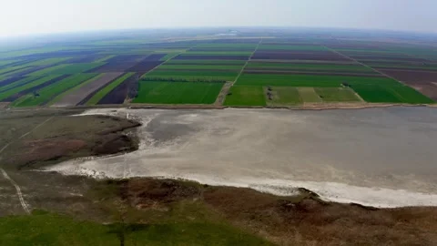 Aerial view of fields and large lake in summer in nature reserve Slano Kopovo Stock Footage 270501900