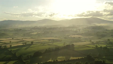 Aerial view of fields and rolling hills during sunset county Down Northern .. Stock Footage 337322803