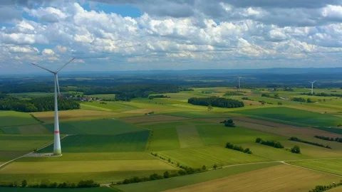 Aerial view of fields and wind turbine Stock Footage 125020649