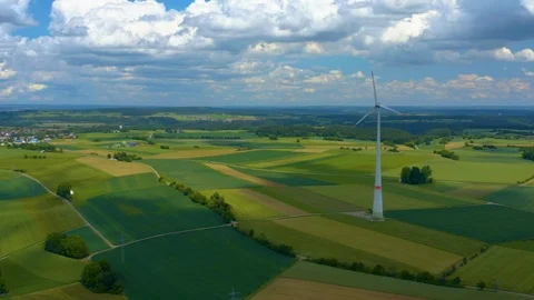 Aerial view of fields and wind turbine Stock Footage 125020775