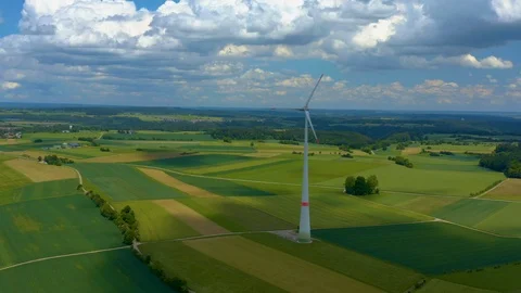 Aerial view of fields and wind turbine Stock Footage 125021344