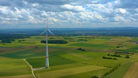 Aerial view of fields and wind turbine Stock Footage 125021525