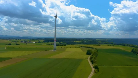 Aerial view of fields and wind turbine Stock Footage 125022371