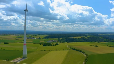 Aerial view of fields and wind turbine Stock Footage 125022537