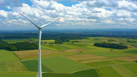 Aerial view of fields and wind turbine Stock Footage 125023848