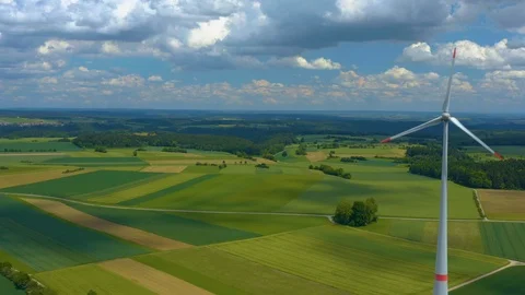Aerial view of fields and wind turbine Stock Footage 125024679