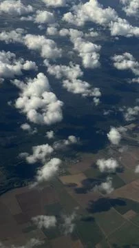 Aerial View of Fields with Clouds Casting Shadows Stock Photos