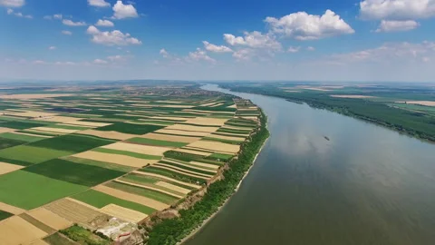 Aerial view of fields on high bank of Danube river Stock Footage 327098171