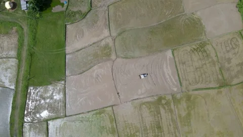 Aerial view of the fields, plowing by Tractors in Nepal, 4K Aerial video Stock Footage 156965293