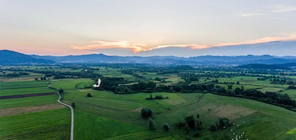 Aerial view of fields at sunset. Stock Photos
