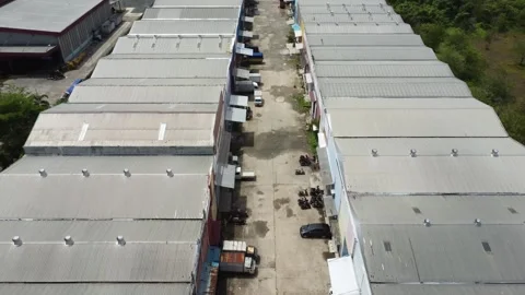 Aerial view of finished goods distribution supply warehouse lined up Stock Footage 325640529