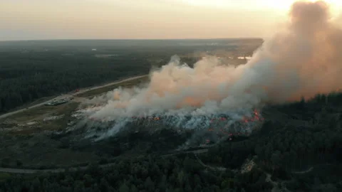 Aerial view at fire at garbage dump, burning pollutes the environment Stock Footage 139364239