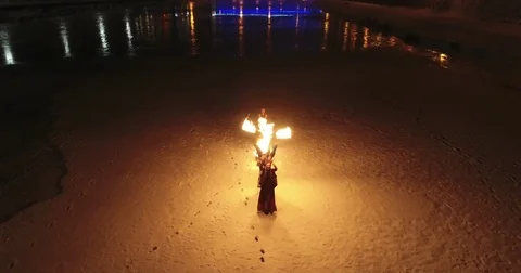 Aerial view of Fire Theater on the ice on frozen river Stock Footage 83937909