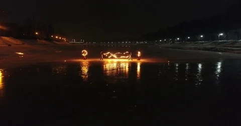 Aerial view of Fire Theater on the ice on frozen river 스톡 동영상 83937997