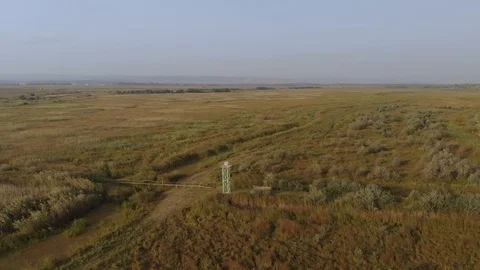 Aerial View of the Fire Tower and Wooden Bridge over the Stream Stock Footage 95780328