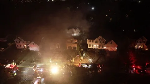 Aerial View of Fire Trucks and Apparatus on Scene of House Fire Stock Footage 104273633