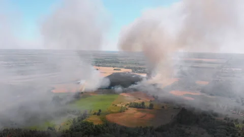 Aerial View of Fire in Wheat Field. Flying over Smoke above Agricultural Fields Stock Footage 135357323