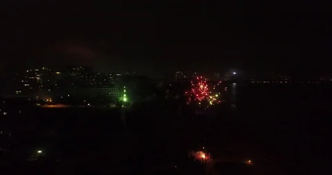 Aerial View of Fireworks Around Beach in Night Stock Footage 103499619
