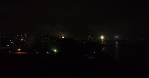 Aerial View of Fireworks Around Beach in Night Stock Footage 103499732