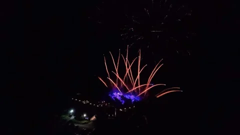 Aerial View of Fireworks Display Over Illuminated Nighttime Countryside Stock Footage 345093430