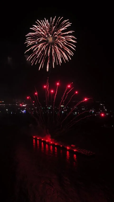 Aerial View of Fireworks Exploding Over Water at Night in Pattaya, Thailand Stock Footage 335843288