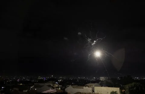 Aerial view of fireworks exploding in a residential area. Stock Photos