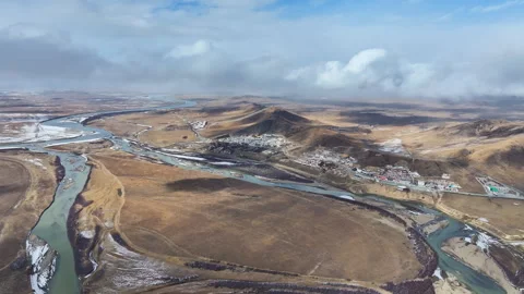 Aerial view of the First Bend of the Yellow River and Sogtsang Monastery Stock Footage 332589088