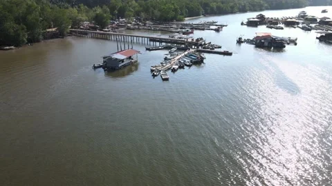 Aerial view of fish cages, forest and river in Kedah Stock Footage 152597103