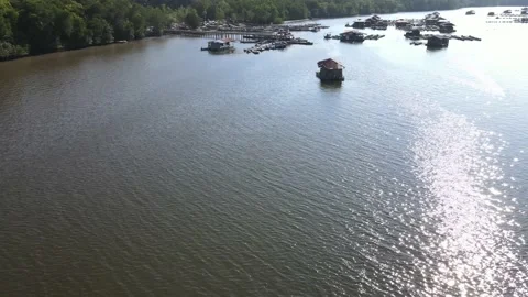 Aerial view of fish pond, river and jetty in Kedah Stock Footage 152596975