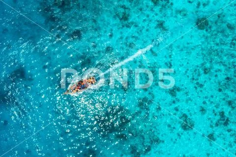 Aerial view of the fishing boat in transparent blue water Stock Photos