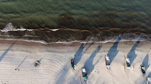 Aerial view of fishing boats on a beach Stock Footage