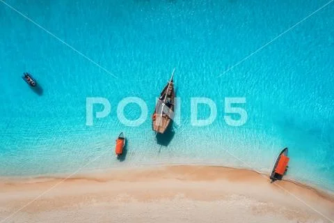 Aerial view of the fishing boats in clear blue water Stock Photos