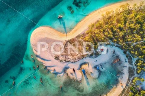 Aerial view of the fishing boats on tropical sea coast Stock Photos