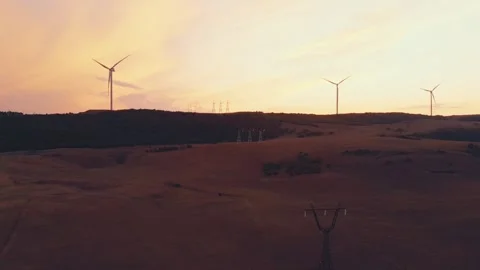 Aerial view five wind turbines standing in green field with beautiful sky b.. 動画素材 242453719