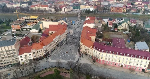Aerial view: Flashmob performed by children in the central square. 4k. 50fps Stockbeeldmateriaal 106181719