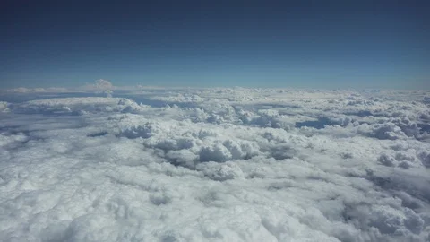 Aerial view of flight above clouds in sunny day Stock Footage 97079539