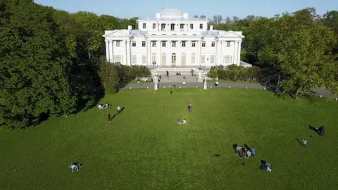Aerial view: Flight above Maslenitsa Meadow with many people, Elagin Park, SPb Stock Footage 76280083