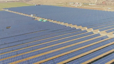 Aerial view, flight above solar panel photo voltaic power station. 動画素材 115181555