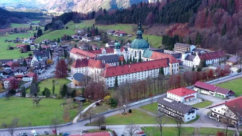 Aerial view, Flight at Benedictine abbey Ettal monastery, Ettal, Oberammergau Stock Footage 99697474